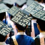 Here's an alt tag for the image: Graduates' caps displaying student loan debt.